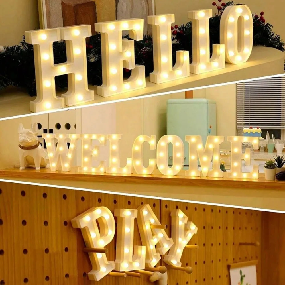 A display of illuminated LED letters spelling out HELLO WELCOME and PLAY used for home and party decor.