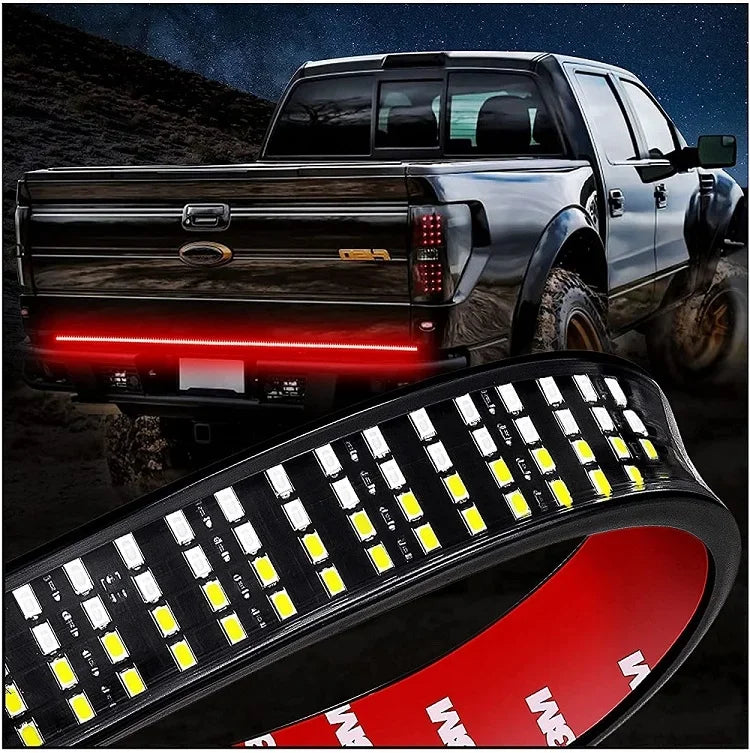 A high-intensity LED light bar is shown mounted on the tailgate of a pickup truck.