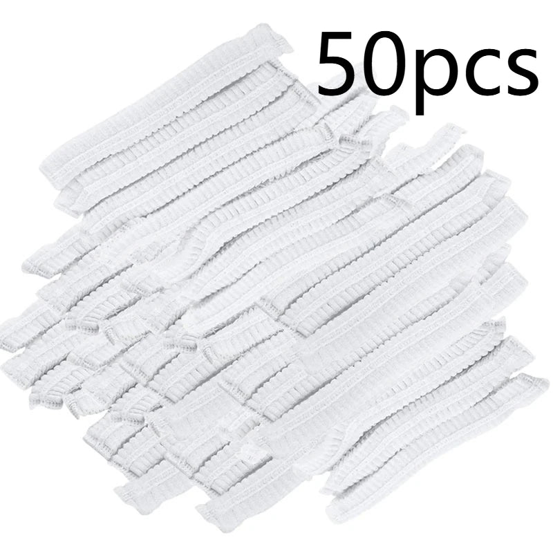 A pile of 50 disposable white broom covers for dust and hair removal.