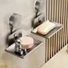 Wall-mounted soap dish with drain featuring a suction cup design for bathroom use