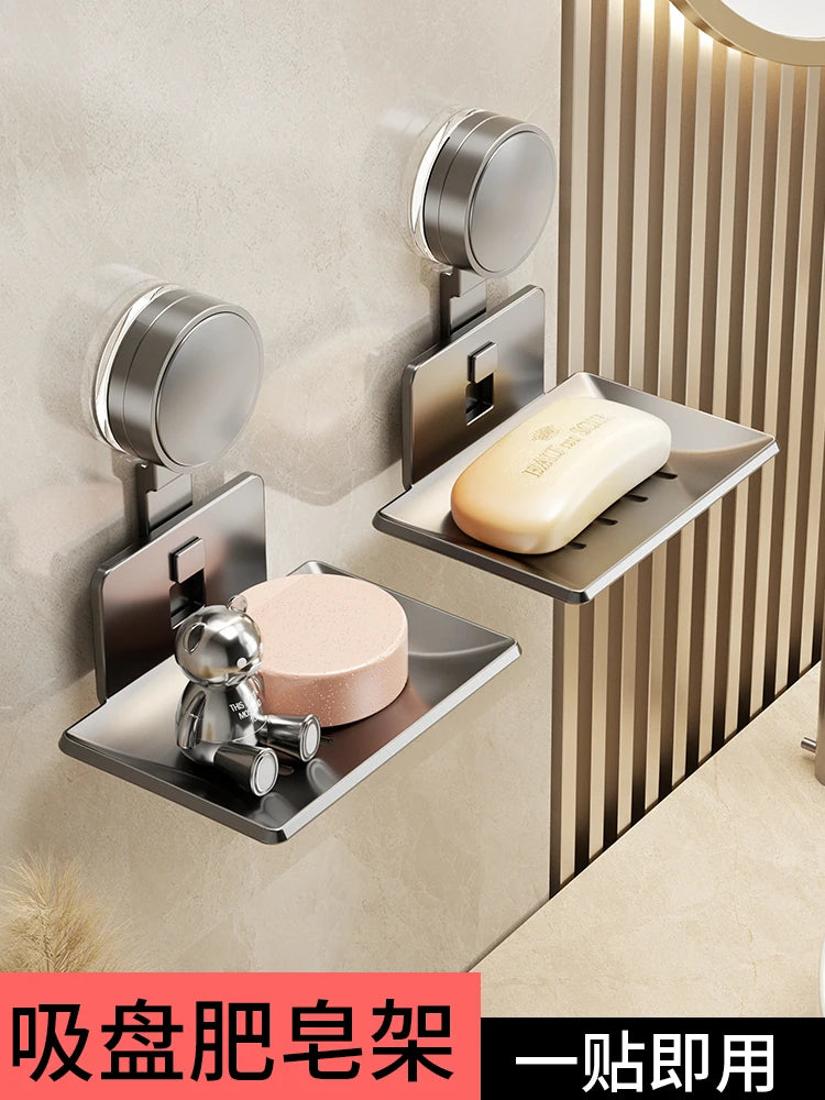 Wall-mounted soap dish with drain featuring a suction cup design for bathroom use