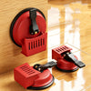 A red heavy-duty floor gap fixer with a suction cup is shown mounted on a wooden surface.