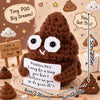 A handmade crochet brown stuffed animal resembling a poo with a sign and surrounding small candies.