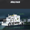 A white 1:24 scale diecast model of a Peterbilt 389 heavy truck with pull-back action, sound, and lights.
