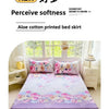 A floral print bed skirt set featuring pink, purple, and green tones with decorative embroidery.