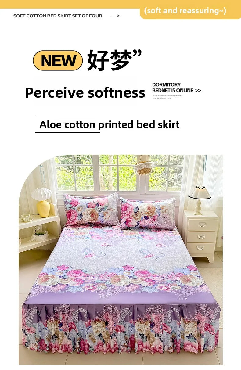 A floral print bed skirt set featuring pink, purple, and green tones with decorative embroidery.