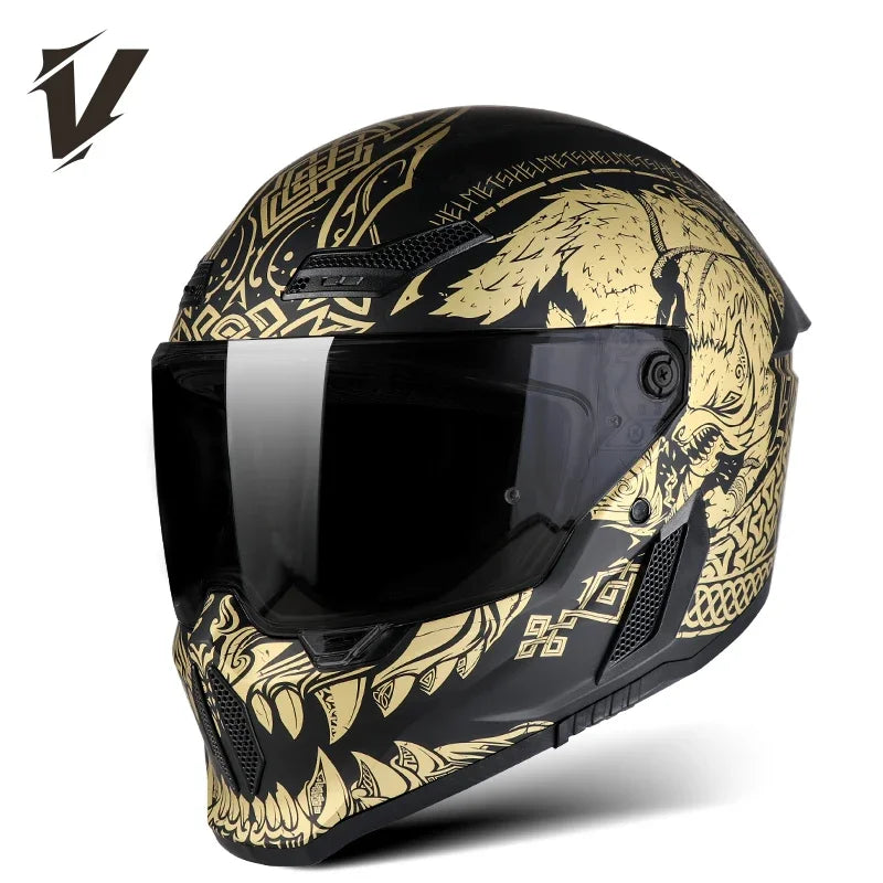 A black full-face motorcycle helmet with gold and black graphic designs and a clear visor.