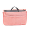 A pink purse organizer insert with multiple compartments and a handle.