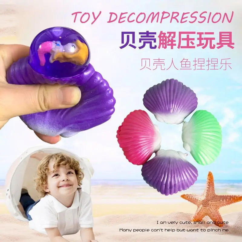 A hand holds a purple mermaid shell squeeze toy, with a child smiling next to an open white shell.