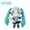 A soft teal plush doll of Hatsune Miku with long blue hair and a dark outfit.