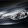 Close-up of a silver car's headlight featuring a 3-inch LED devil eye design.