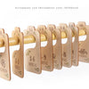 A wooden baby closet divider set with eight size organizers for newborns through 24 months.