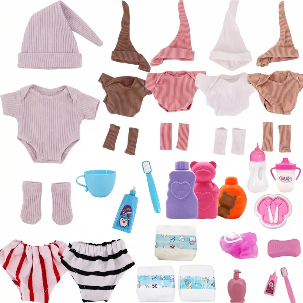 A collection of pink and beige clothing items for dolls including a hat, jumpsuit, socks, and various accessories.