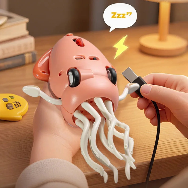 A hand holds a pink octopus toy with white tentacles and a black connector, demonstrating its interactive features.