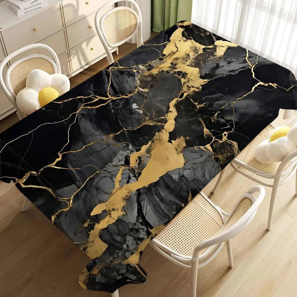 Black gold marble waterproof tablecloth displayed on a table with white wicker chairs.