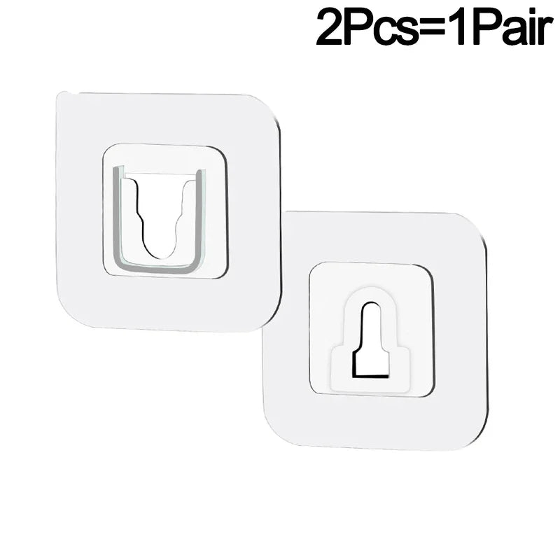 A set of two white invisible adhesive hooks for removable wall mounting.