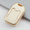 A beige TPU smart key fob cover for GMC and Chevrolet trucks and SUVs, shown in a close-up view.