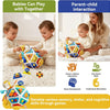 A toddler plays with a colorful 22-in-1 busy board activity cube, demonstrating parent-child interaction and fine motor skill