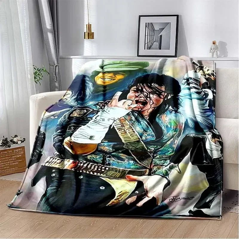 A colorful print of Michael Jackson on a flannel throw blanket