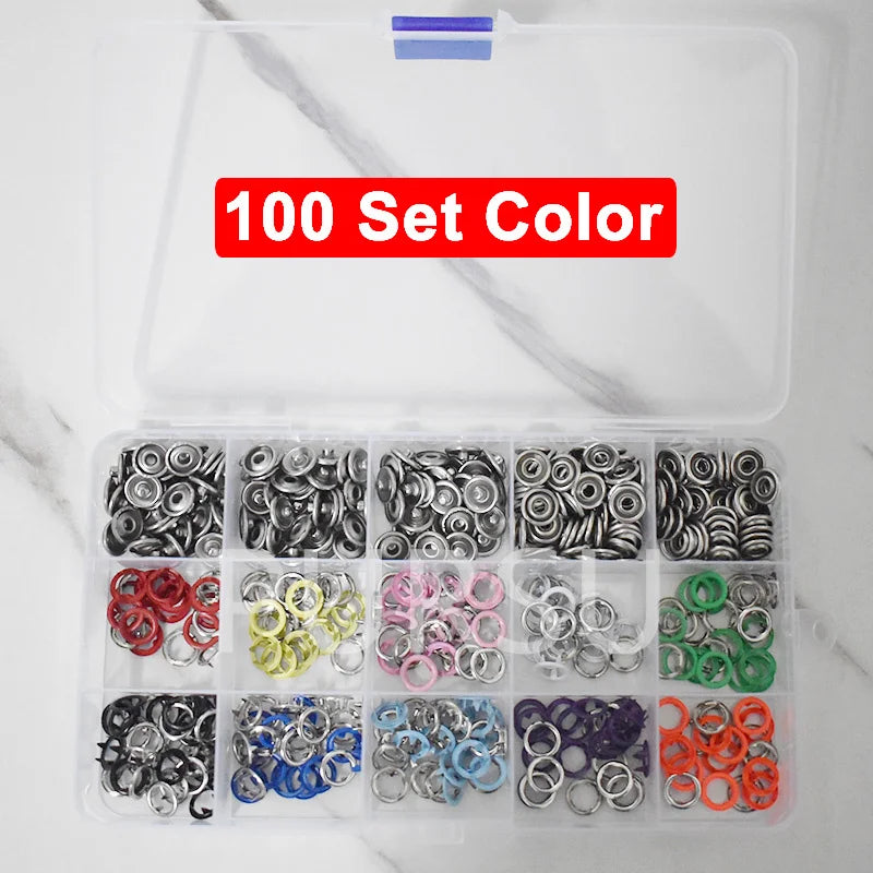 A clear plastic container holding 100 sets of colorful metal snap buttons for clothing and crafts.