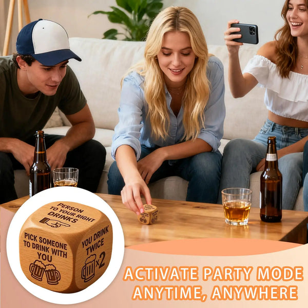 A wooden dice drinking game is shown on a table with people in the background.
