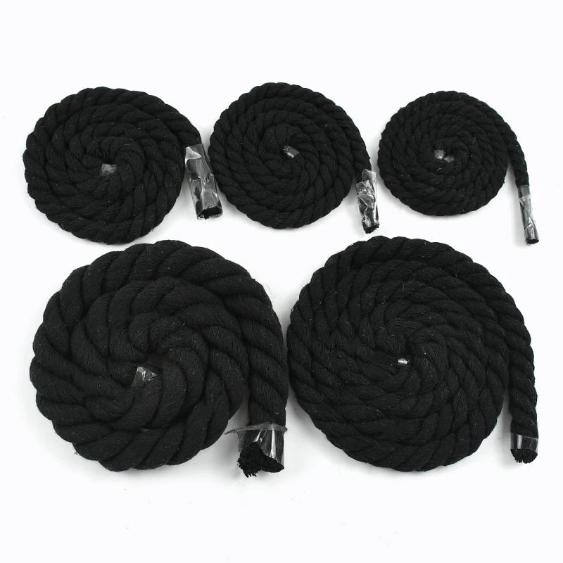 Eight coils of black natural twisted cotton cord arranged in a circle.