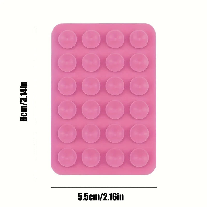 A pink silicone suction phone mount with multiple circular suction cups.