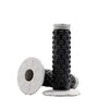 A close-up view of black and white motorcycle handlebar grips for dirt bikes.