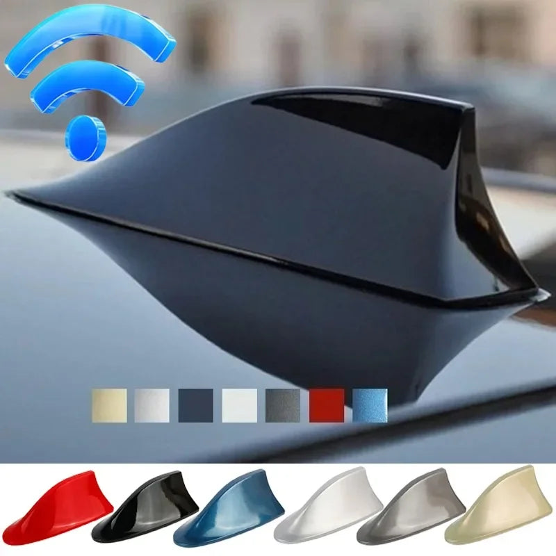 A black shark fin car antenna with various color options displayed on a car surface.