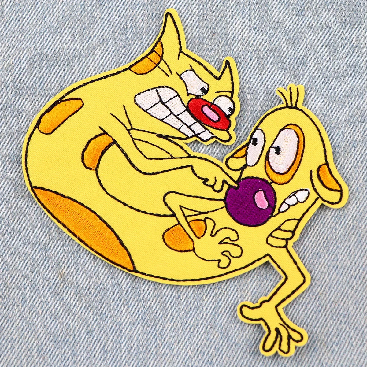 Yellow embroidered cat dragon iron-on patch featuring an angry expression and orange accents.