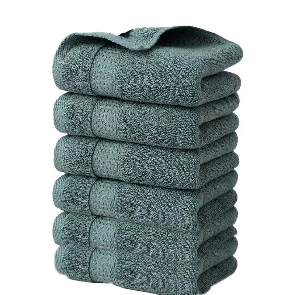 A stack of six gray textured face towels
