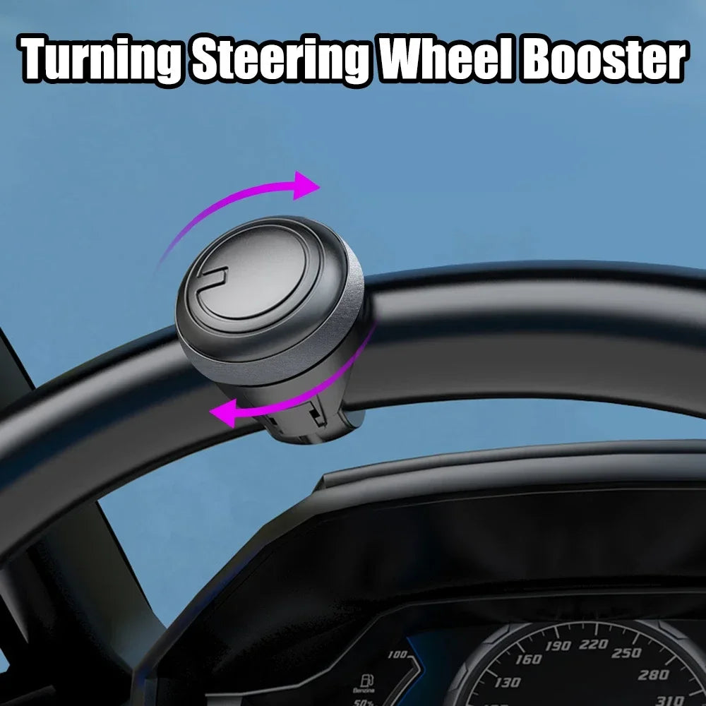 A black turning steering wheel booster device is shown being attached to a car steering wheel.