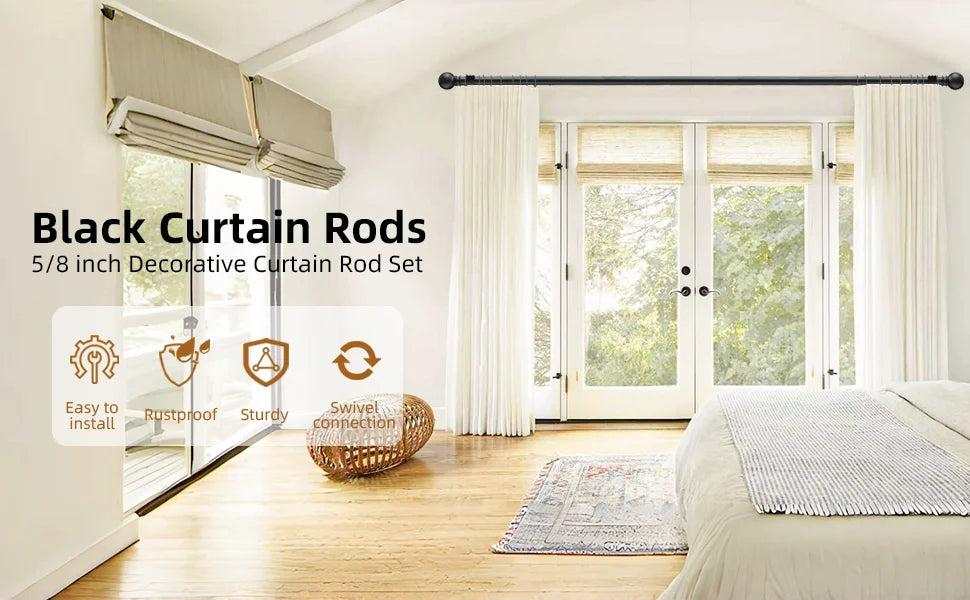 A set of black decorative curtain rods installed in a bright room with large glass doors and white curtains.