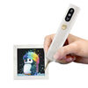 A hand holds a white electric diamond art pen with a black and colorful design on the tip.