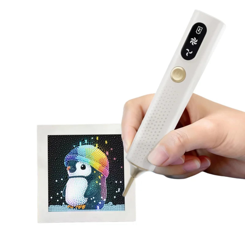 A hand holds a white electric diamond art pen with a black and colorful design on the tip.