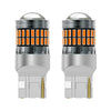A pair of LED turn signal and reverse light bulbs with clear glass lenses and silver bases.