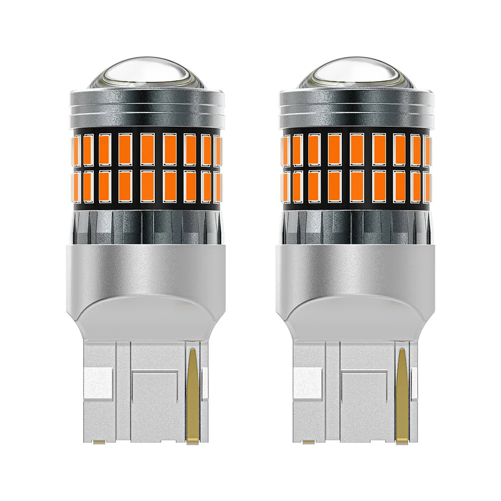 A pair of LED turn signal and reverse light bulbs with clear glass lenses and silver bases.