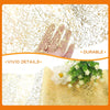 Metallic gold glitter table runner with floral accents and a hand touching the surface.