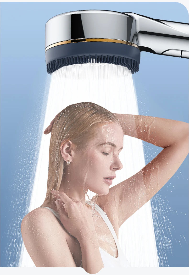 A woman is under a high-pressure shower head, showing water spray and foam.