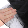 Close-up of a hand holding black lace canopy mosquito net fabric