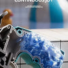 A close-up of a blue and teal mini mechanical revolver water gun resting on a white surface.