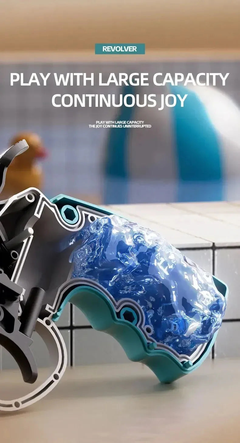 A close-up of a blue and teal mini mechanical revolver water gun resting on a white surface.