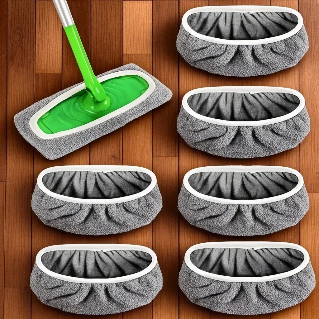 Set wiederverwendbare graue Mikrofasertücher und ein grüner Mopp auf einer Holzoberfläche.