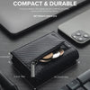A black slim pop-up wallet is shown open, displaying coins and a zipper pocket on a dark surface.