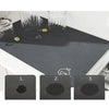 Three black mats showing increasing levels of absorption or damage, used for washing machine protection.
