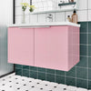 Glitter pink peel-and-stick vinyl contact paper used on a kitchen cabinet and countertop.