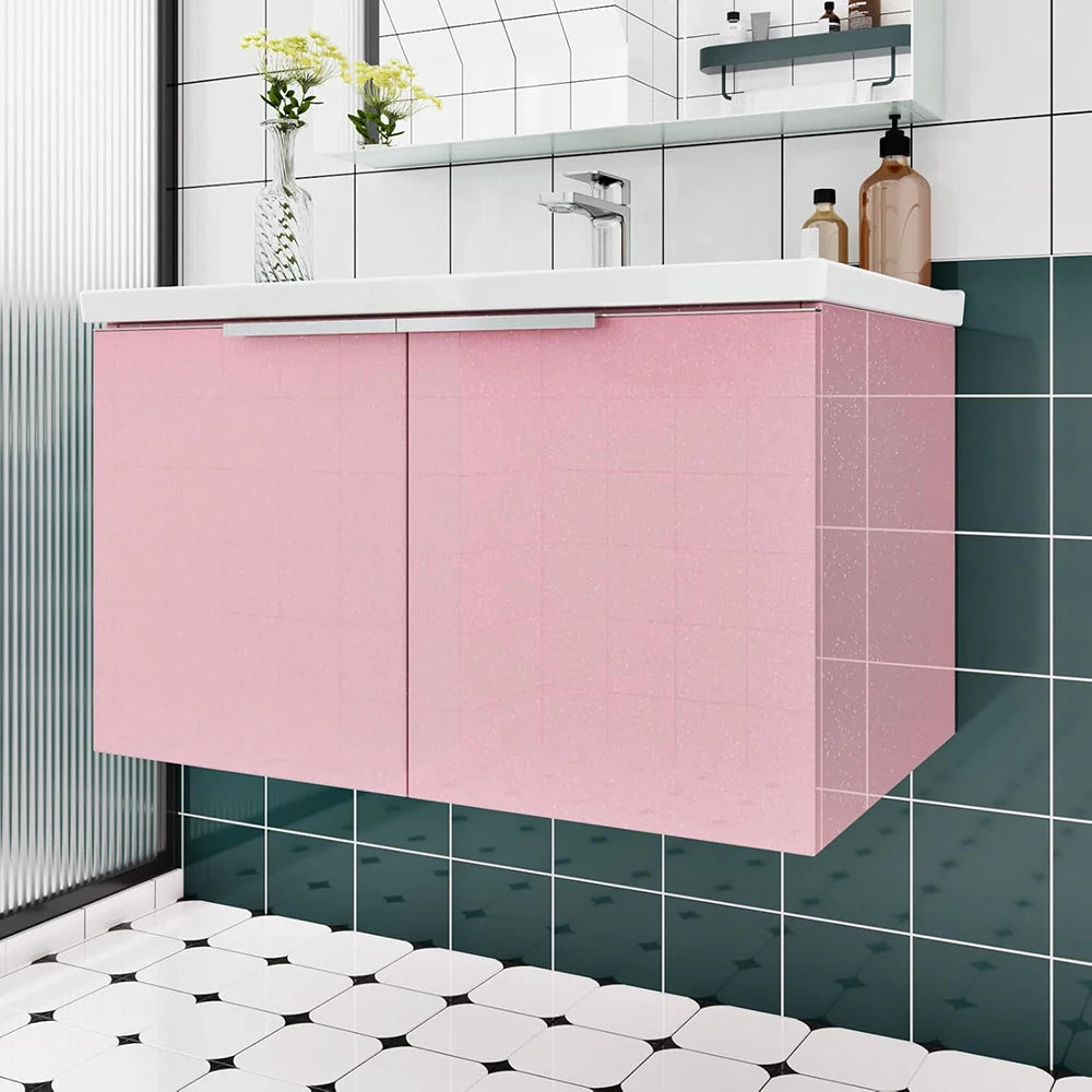 Glitter pink peel-and-stick vinyl contact paper used on a kitchen cabinet and countertop.
