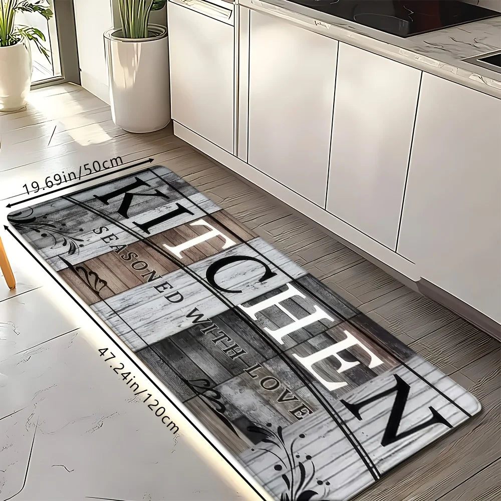 A rectangular kitchen mat featuring a distressed wood grain design with black and white accents placed on a light wooden floo