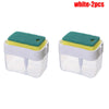 Two white press-type portable soap dispensers with green foam pads and yellow accents.