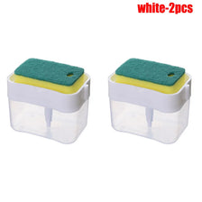 Two white press-type portable soap dispensers with green foam pads and yellow accents.